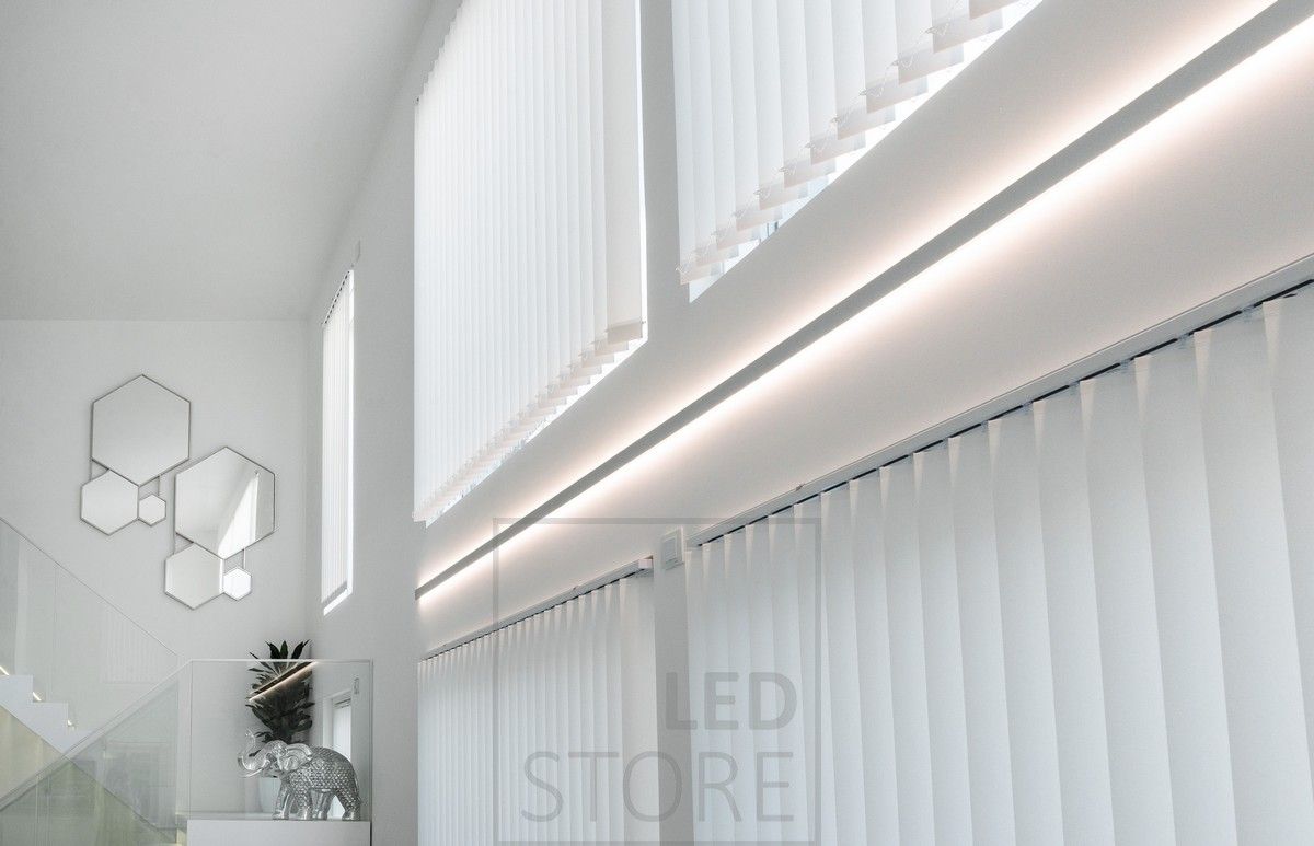 Led strip on a bi-directional wall profile to emphasise the height of the room and create indirect mood lighting in the space.